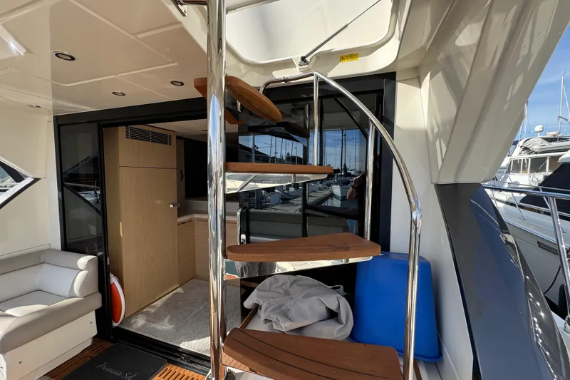 Slide: The Image of Luxurious interior of 2020 Beneteau Monte Carlo 52 yacht with spiral staircase. - 41