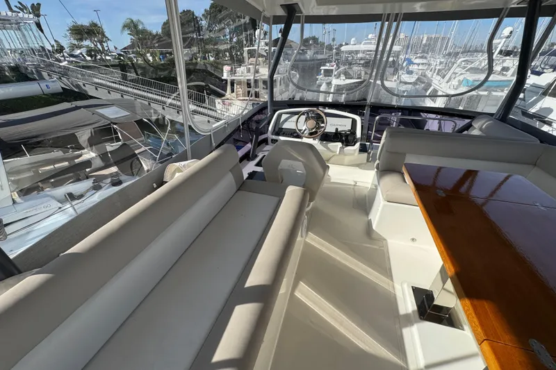 Slide: The Image of Luxurious interior of 2020 Beneteau Monte Carlo 52 yacht with plush seating and helm. - 44