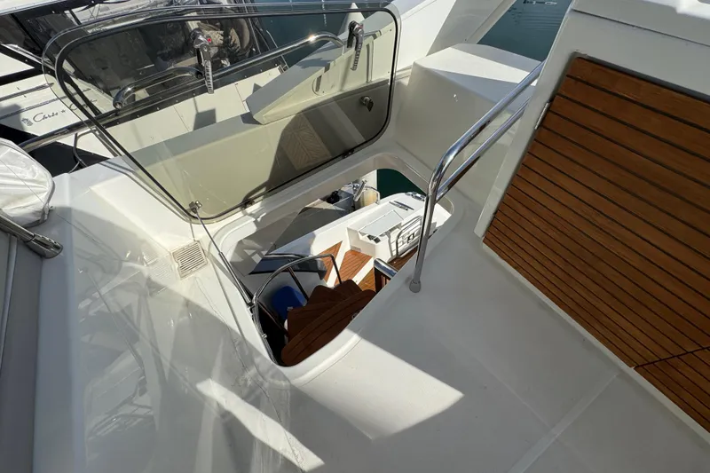 Slide: The Image of Staircase on 2020 Beneteau Monte Carlo 52 yacht with wooden accents and sleek design. - 55