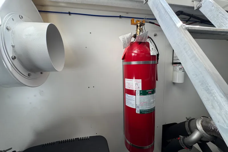 Slide: The Image of Fire extinguisher in engine room of 2020 Beneteau Monte Carlo 52 yacht. - 61