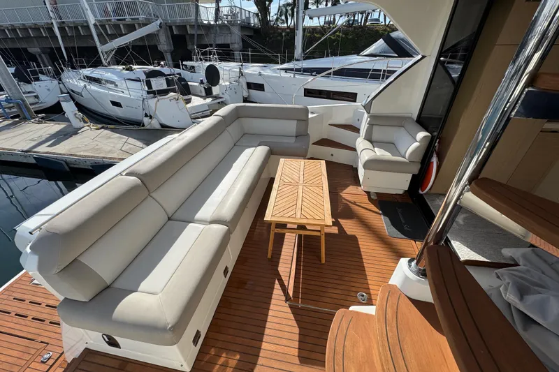 Slide: The Image of Luxurious seating area on 2020 Beneteau Monte Carlo 52 yacht with wooden deck. - 9
