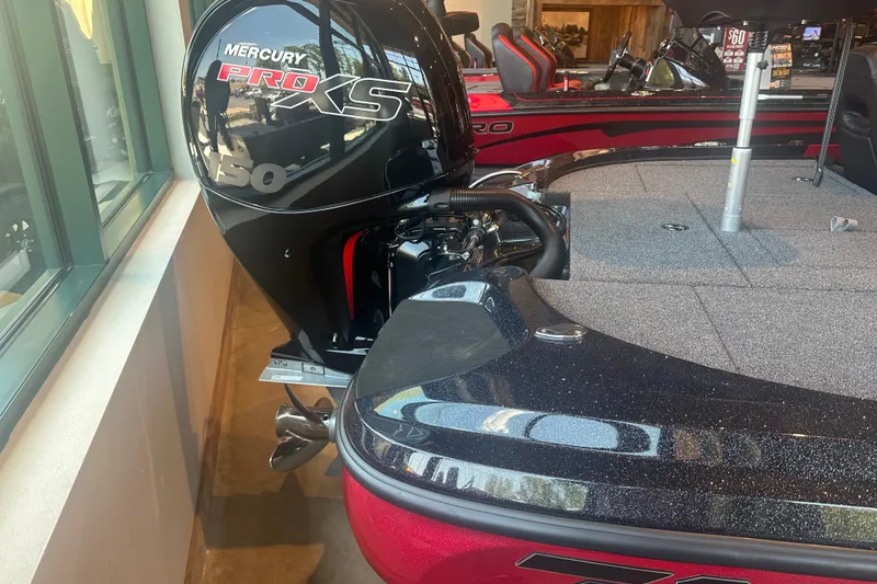 Slide: The Image of 2025 Nitro Z18 Pro boat with Mercury Pro XS 150 engine in showroom. - 13