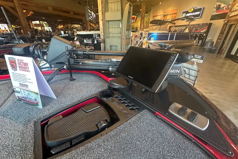 Slide: The Image of 2025 Nitro Z18 Pro boat dashboard with Garmin display and warranty information. - 7