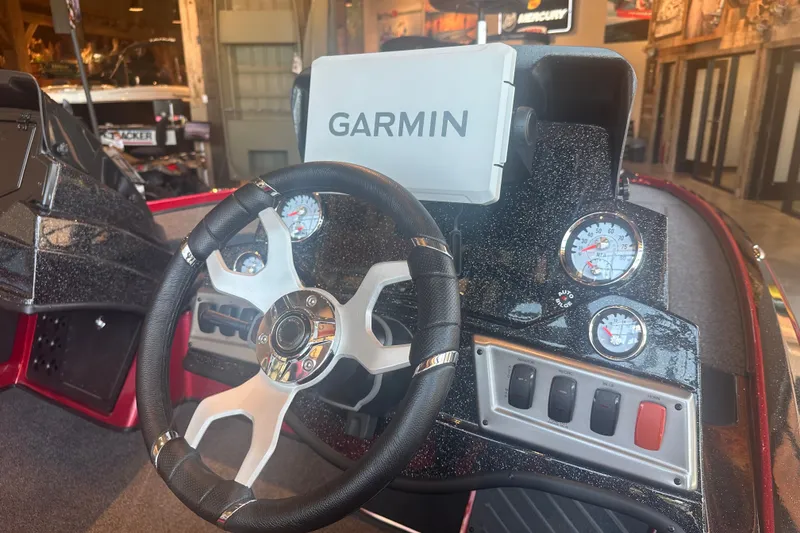 Slide: The Image of Steering wheel and dashboard of 2025 Nitro Z18 Pro boat with Garmin display. - 10