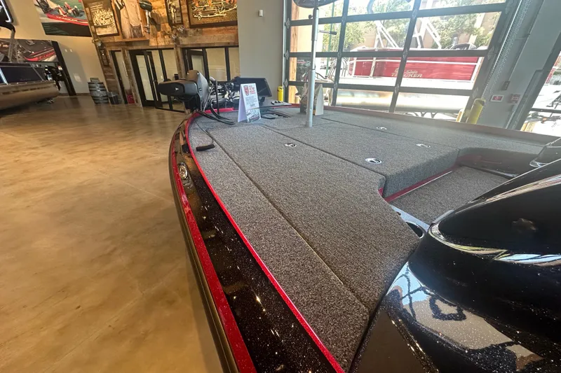 Slide: The Image of 2025 Nitro Z18 Pro boat interior with carpeted deck in showroom. - 5