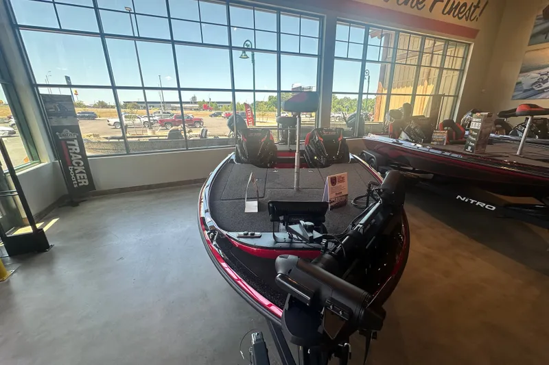 Slide: The Image of 2025 Nitro Z18 Pro boat displayed in showroom with large windows and outdoor view. - 14