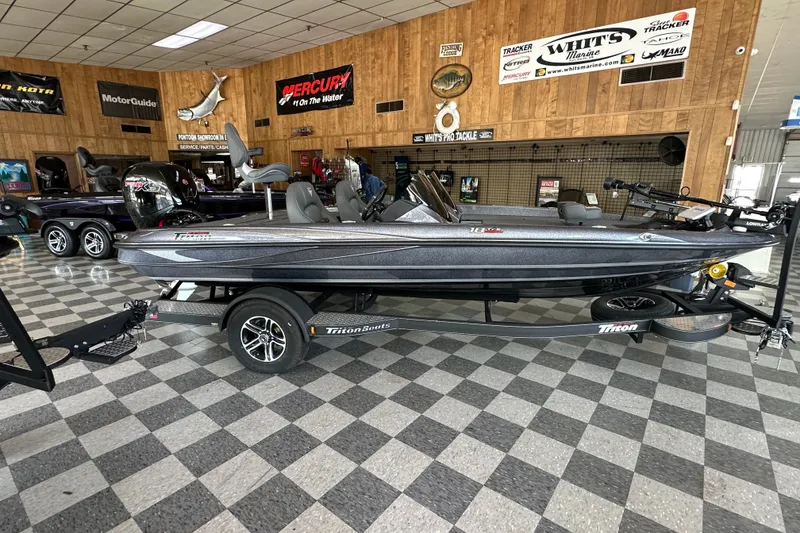 The Image of 2024 Triton 18 TrX boat displayed in showroom with checkered floor. - 0