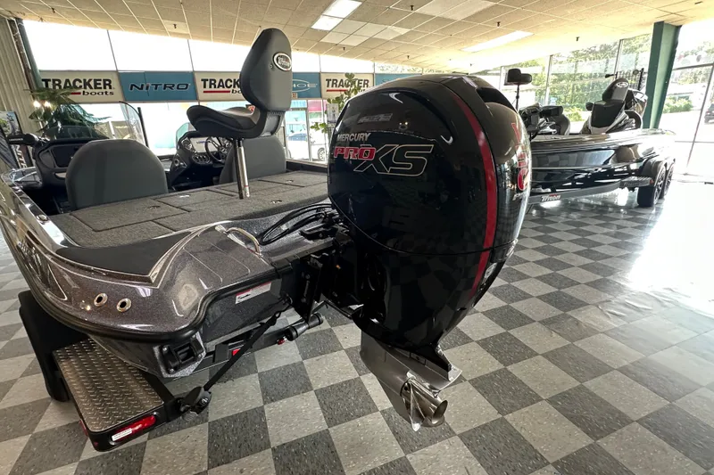 Slide: The Image of 2024 Triton 18 TrX boat with Mercury Pro XS engine in showroom. - 55