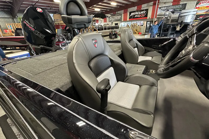 Slide: The Image of Interior of 2025 Triton 19 TrX Patriot boat with sleek seating and modern design. - 15