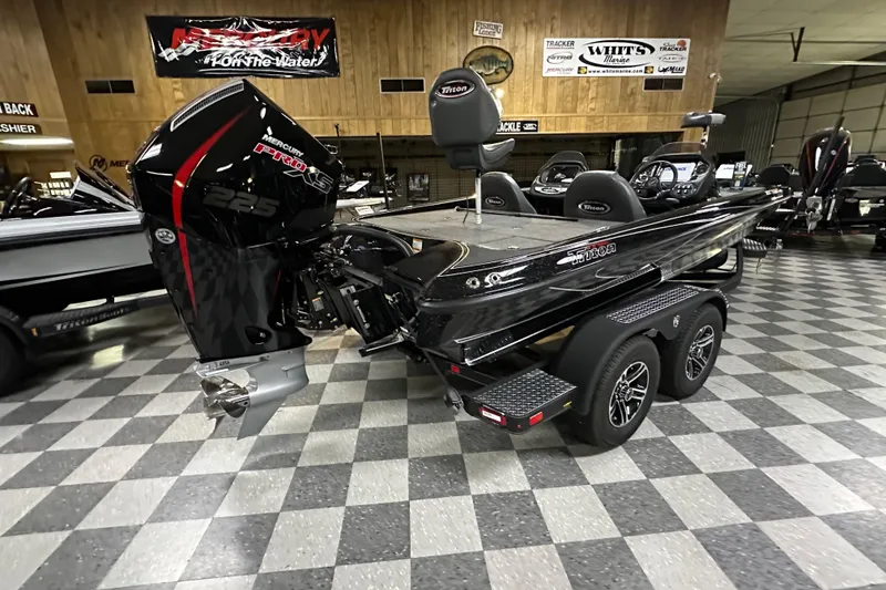 Slide: The Image of 2025 Triton 19 TrX Patriot boat with Mercury Pro XS 225 engine in showroom. - 62