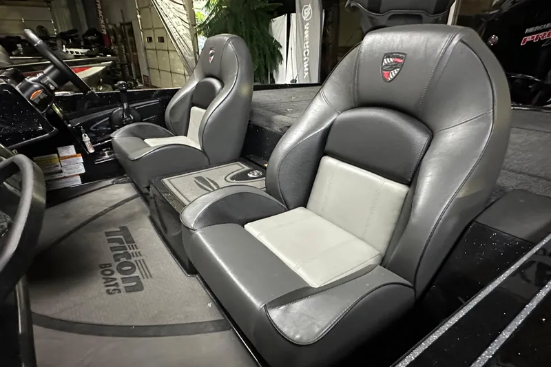 Slide: The Image of 2025 Triton 19 TrX Patriot boat interior with sleek, comfortable seating and modern design. - 77