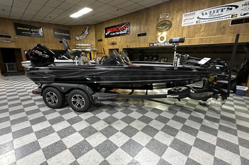 Slide: The Image of 2025 Triton 19 TrX Patriot boat displayed indoors on a checkered floor. - 58