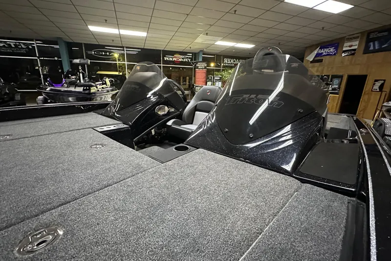 Slide: The Image of 2025 Triton 19 TrX Patriot boat interior with sleek design and spacious seating. - 66