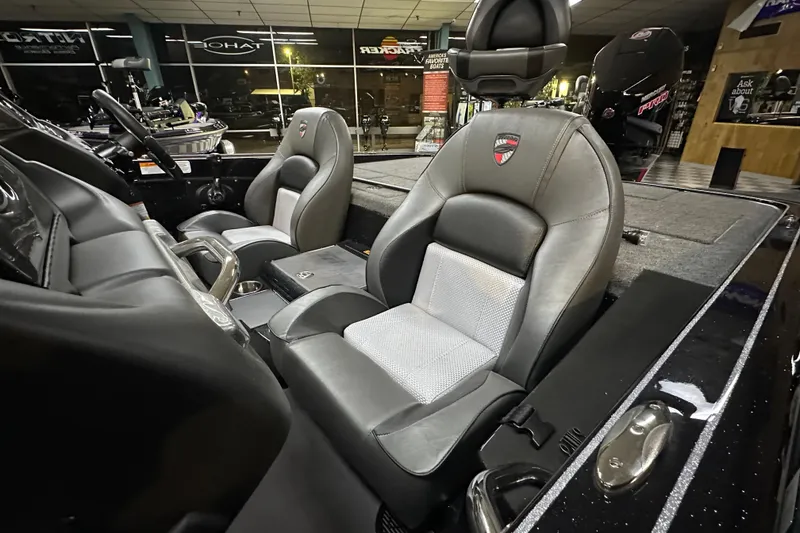 Slide: The Image of 2025 Triton 19 TrX Patriot boat interior with sleek, modern seating design. - 68