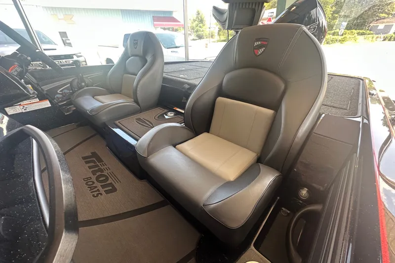 Slide: The Image of 2026 Triton 20XP Patriot boat interior with premium seating and dashboard view. - 133