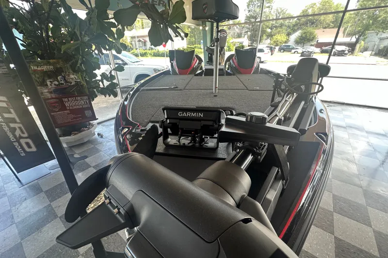 Slide: The Image of 2026 Triton 20XP Patriot boat with Garmin equipment in showroom display. - 130