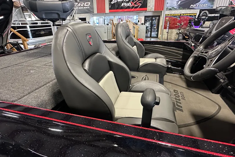 Slide: The Image of Interior of 2026 Triton 20XP Patriot boat with sleek seating and modern dashboard. - 7