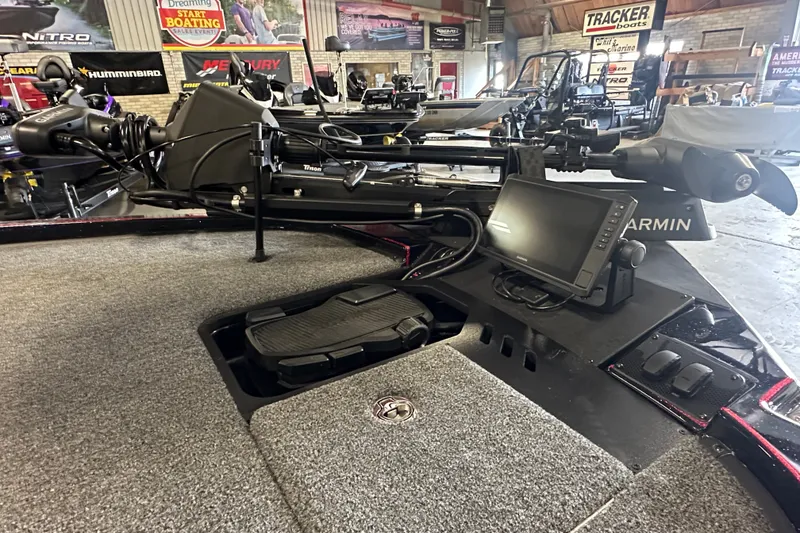 Slide: The Image of 2026 Triton 20XP Patriot boat interior with Garmin navigation system and trolling motor. - 10