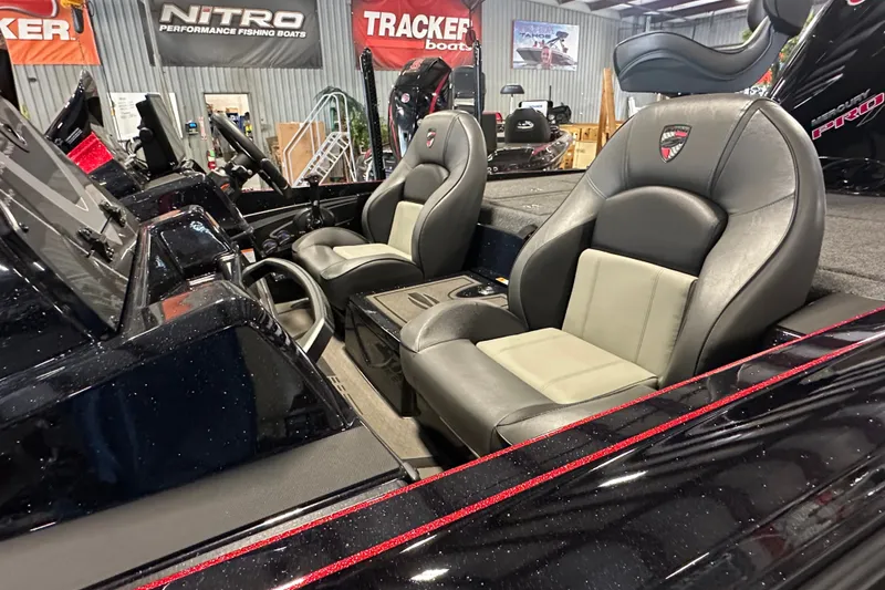 Slide: The Image of 2026 Triton 20XP Patriot boat interior with premium seating and sleek design. - 13