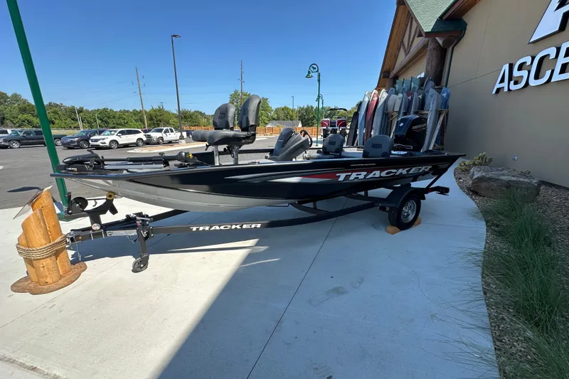 The Image of 2026 Tracker Pro Team 175 Crappie Edition boat displayed outdoors on a trailer. - 0