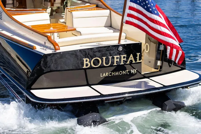 Slide: The Image of Hinckley Talaria 34 boat, 2014 model, with American flag, named "Bouffal," Larchmont, NY. - 5