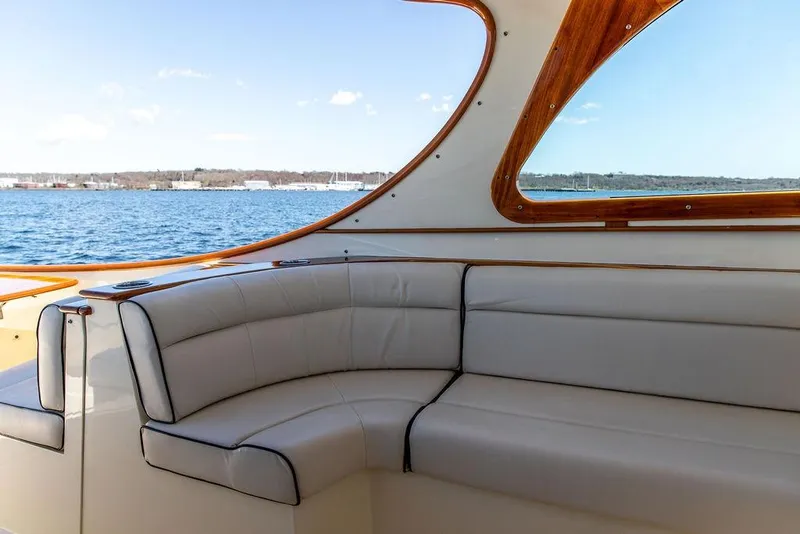 Slide: The Image of Luxurious interior of 2014 Hinckley Talaria 34 yacht with elegant seating and scenic ocean view. - 8