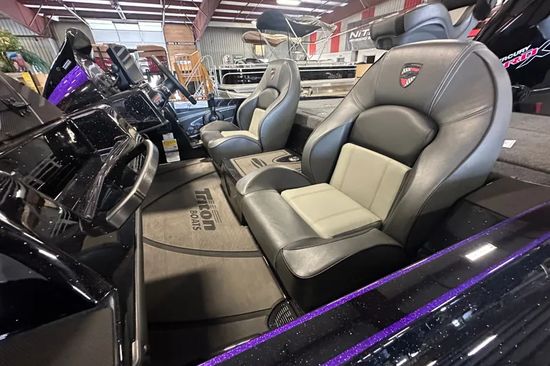 Slide: The Image of Interior of 2026 Triton 20XP Patriot boat with sleek leather seating and modern dashboard. - 20