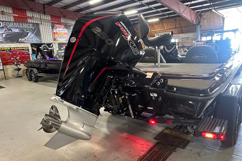 Slide: The Image of 2026 Triton 20XP Patriot boat with powerful Mercury 250 engine in showroom. - 30