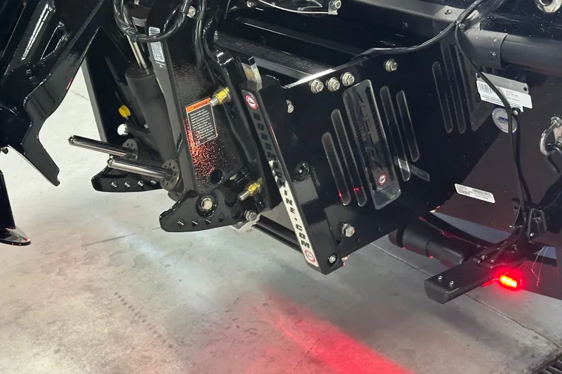Slide: The Image of Close-up of 2026 Triton 20XP Patriot boat engine mount with hydraulic components. - 31