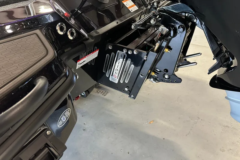 Slide: The Image of 2026 Triton 20XP Patriot boat engine mount detail in a garage setting. - 17