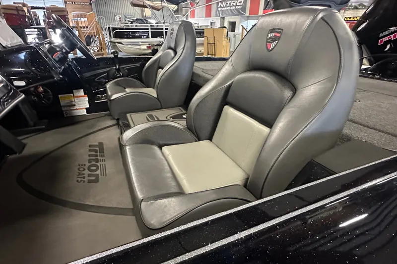 Slide: The Image of Interior of 2025 Triton 21XP Patriot boat with sleek leather seats and branded flooring. - 17