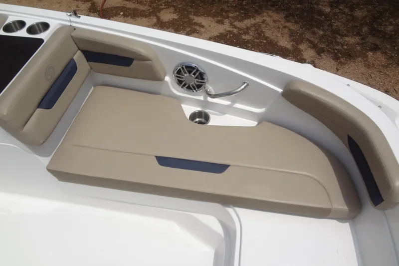 Slide: The Image of 2022 Hurricane SunDeck Sport 185 OB boat seating area with beige cushions and cup holders. - 10