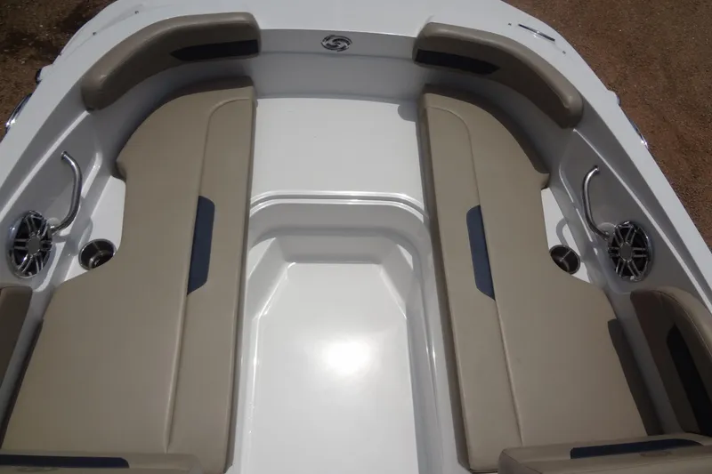 Slide: The Image of 2022 Hurricane SunDeck Sport 185 OB boat interior with beige seating and cup holders. - 11
