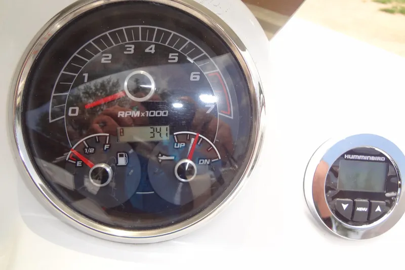 Slide: The Image of Dashboard of 2022 Hurricane SunDeck Sport 185 OB with RPM and fuel gauges. - 17