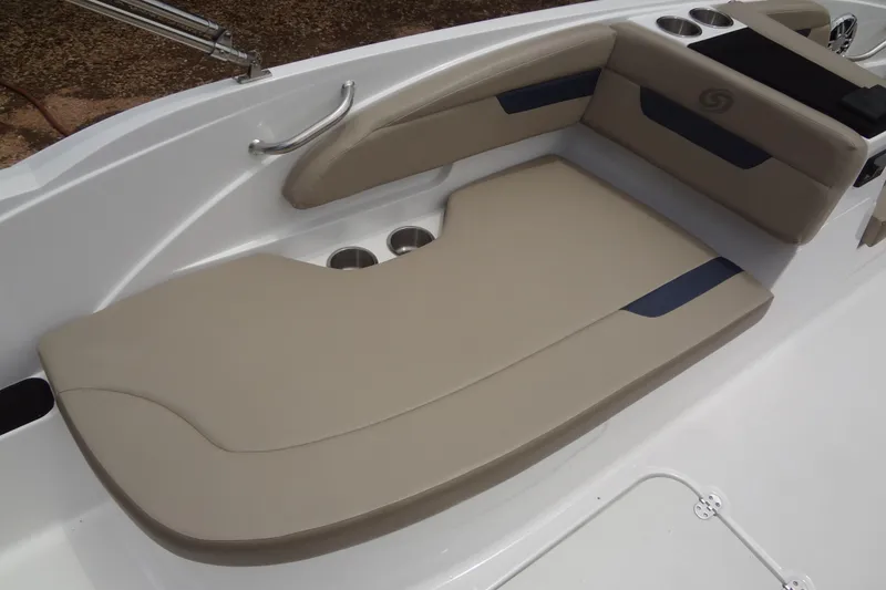 Slide: The Image of 2022 Hurricane SunDeck Sport 185 OB boat interior with beige seating and cup holders. - 21