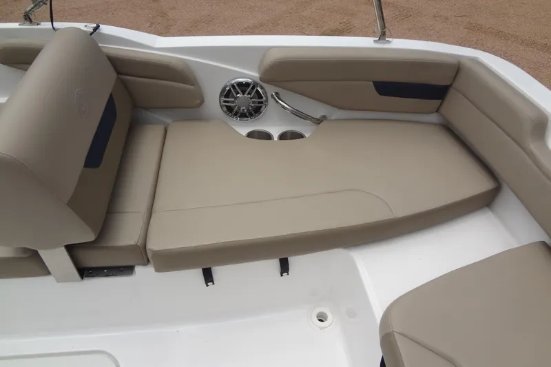 Slide: The Image of 2022 Hurricane SunDeck Sport 185 OB boat interior with beige seating and speaker. - 23