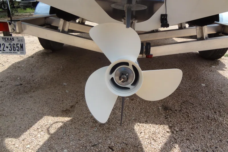 Slide: The Image of Propeller of 2022 Hurricane SunDeck Sport 185 OB on trailer, Texas license plate visible. - 33