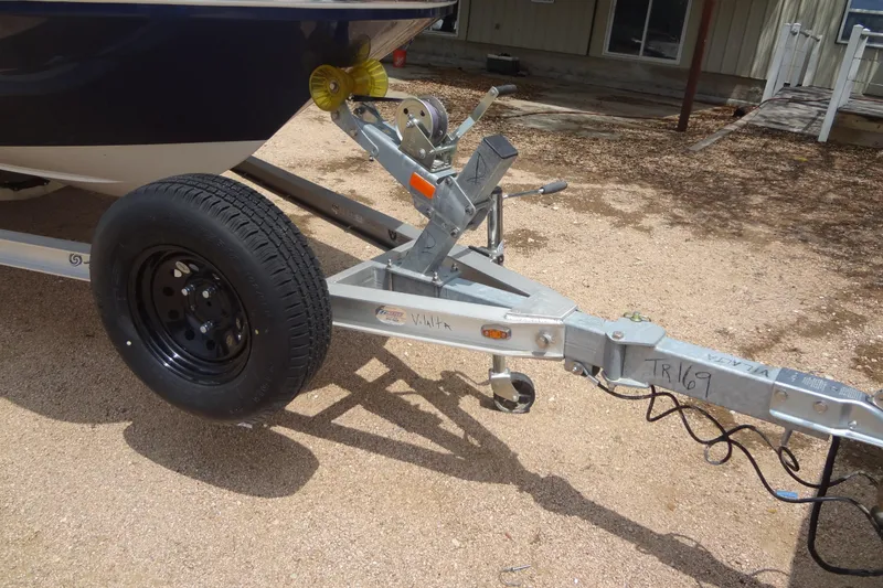 Slide: The Image of Trailer hitch of 2022 Hurricane SunDeck Sport 185 OB boat on gravel surface. - 37