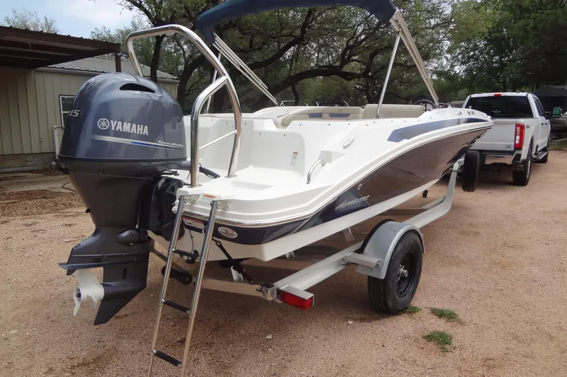 Slide: The Image of 2022 Hurricane SunDeck Sport 185 OB boat with Yamaha outboard motor on trailer. - 4