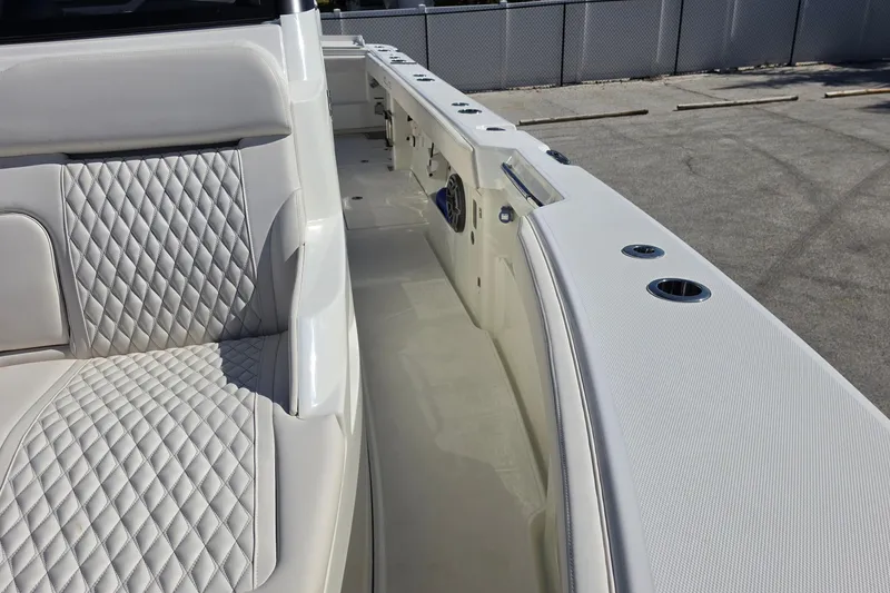Slide: The Image of Luxurious interior of 2026 Solace 35CS boat with quilted seating and sleek design. - 13