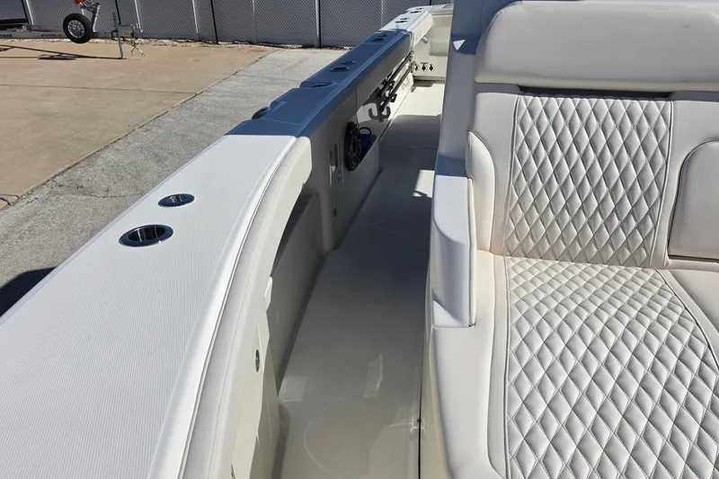 Slide: The Image of Luxury seating on 2026 Solace 35CS boat with quilted upholstery and sleek design. - 14