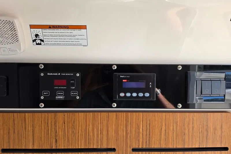 Slide: The Image of Control panel of a 2026 Solace 35CS with warning label and monitoring systems. - 18