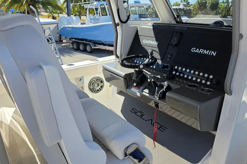 Slide: The Image of Interior view of 2026 Solace 35CS boat cockpit with Garmin navigation system. - 24