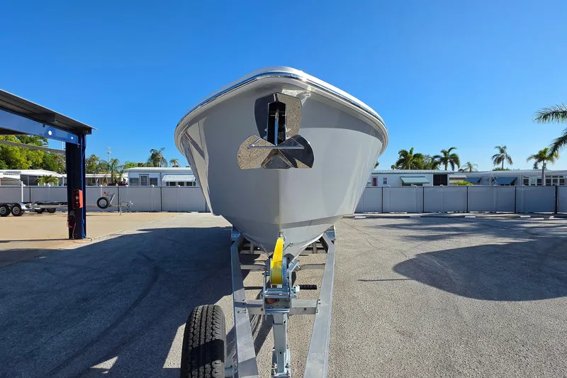 Slide: The Image of Front view of 2026 Solace 35CS boat on trailer under clear blue sky. - 3