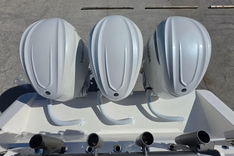 Slide: The Image of Triple outboard engines on a 2026 Solace 35CS boat, viewed from above. - 9