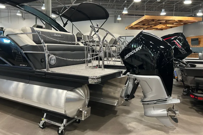 Slide: The Image of 2026 Barletta Corsa 23UA pontoon boat with Mercury outboard motor. - 9