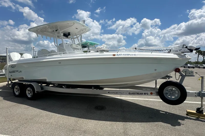 The Image of 2022 Glasstream 280 Pro-XS boat on trailer under a bright blue sky. - 0
