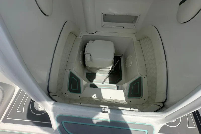 Slide: The Image of Interior of 2022 Glasstream 280 Pro-XS boat with compact toilet setup. - 12