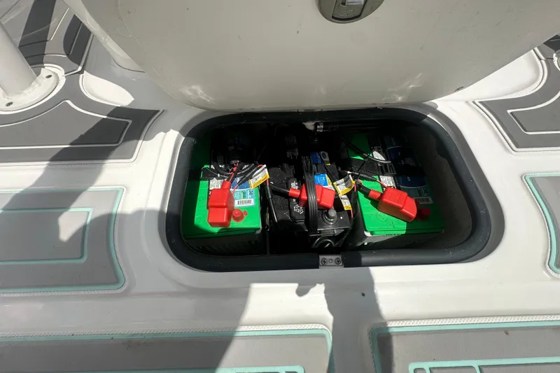 Slide: The Image of Battery compartment of a 2022 Glasstream 280 Pro-XS boat, showing multiple batteries. - 15