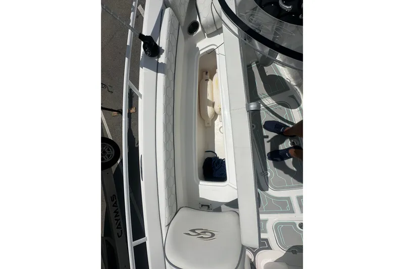 Slide: The Image of 2022 Glasstream 280 Pro-XS boat interior with storage compartment and seating. - 16